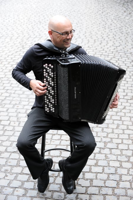 Craig Bradley playing accordion outdoors